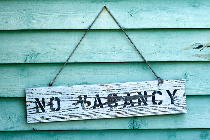 No Vacancy sign representing high occupancy rates for Lodging industry